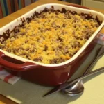 Delicious Venison and Wild Rice Casserole, featuring tender venison, wild rice, topped with fresh parsley and a golden, creamy finish."